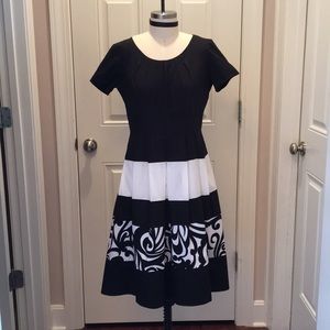 Black and white, modern tea-length dress.